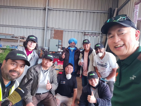 Volunteers propagating indigenous seedlings at nursery tables